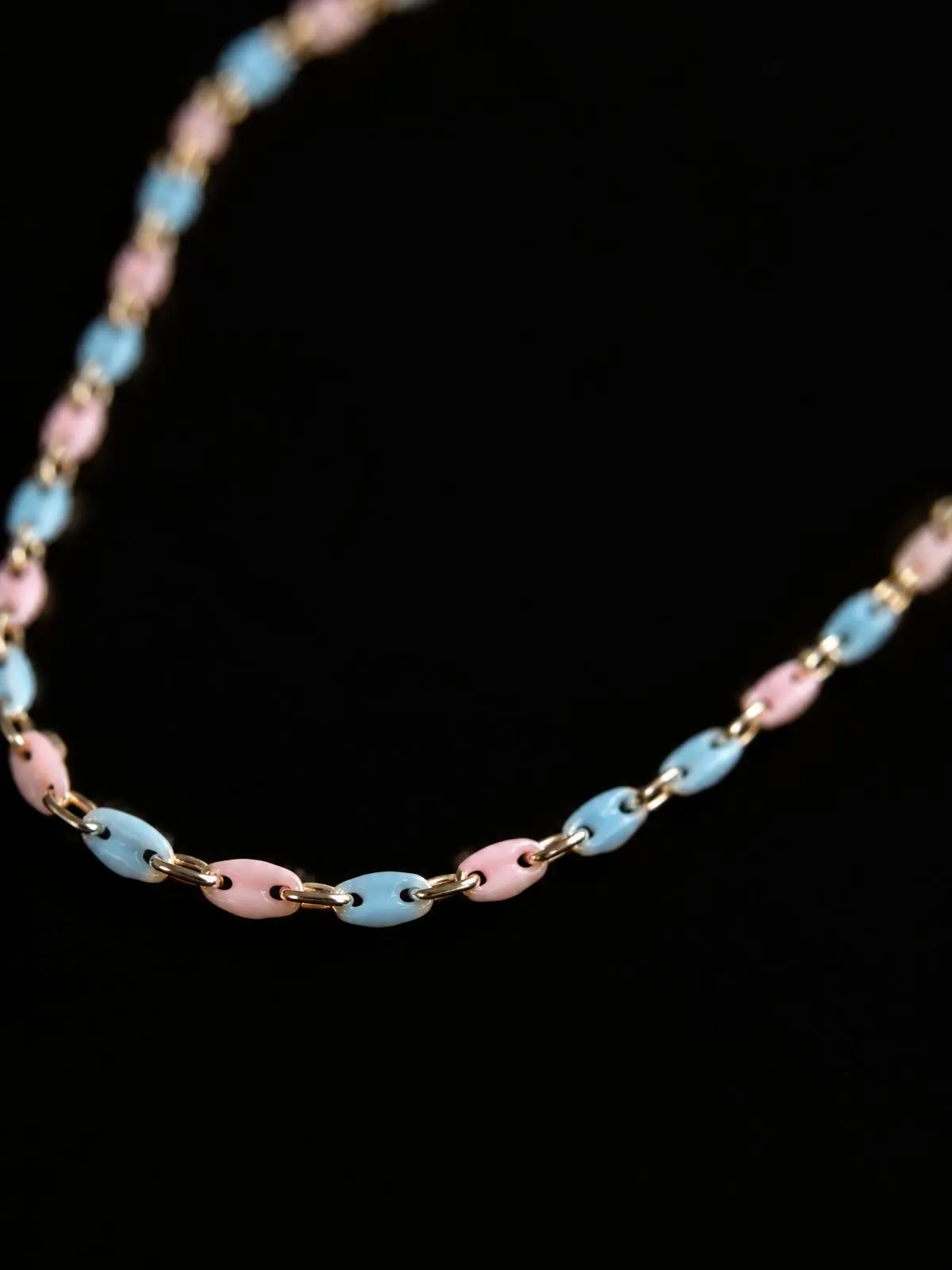 Macro of a seasonal chain with soft colored links on black